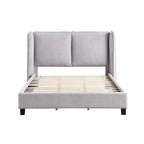 Lit plateforme moderne grand format en tissu résilient, avec tête de lit capitonnée à oreilles.